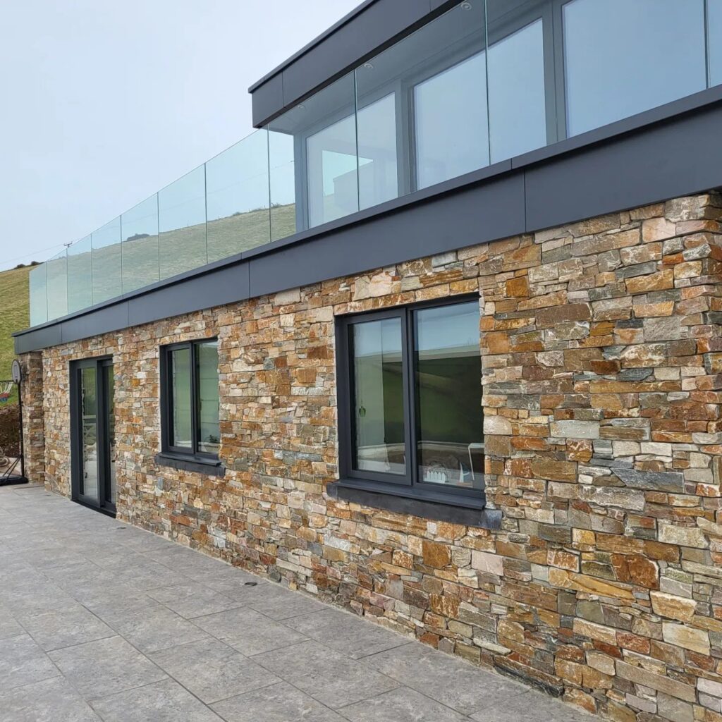 Shallow pitched roof replaced with new pitched roof to allow for additional accommodation.